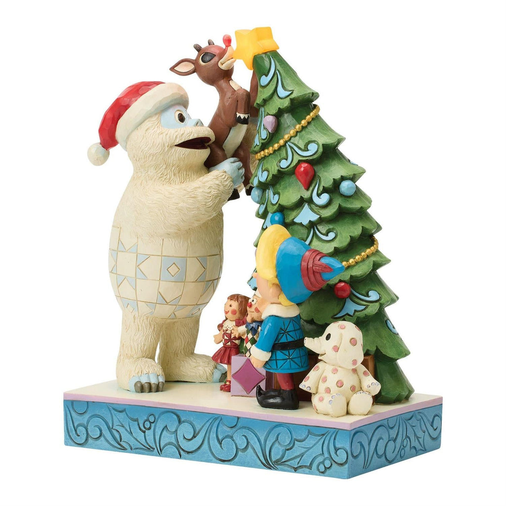 Bumble Holding Rudolph by Tree